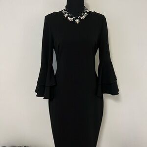 Calvin Klein black flared sleeve little black dress.